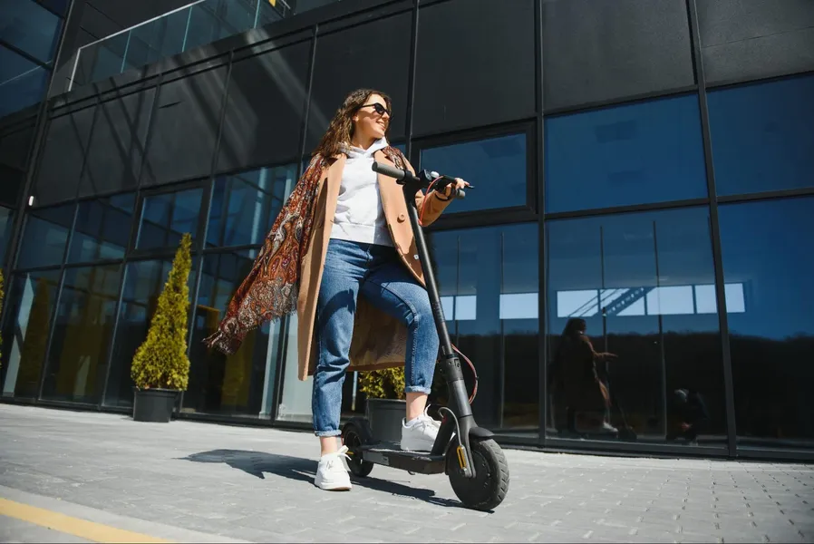 Young professional with electric scooter in Tampa