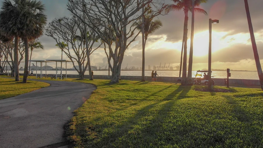 Family biking on the Ream Wilson Trail at sunset