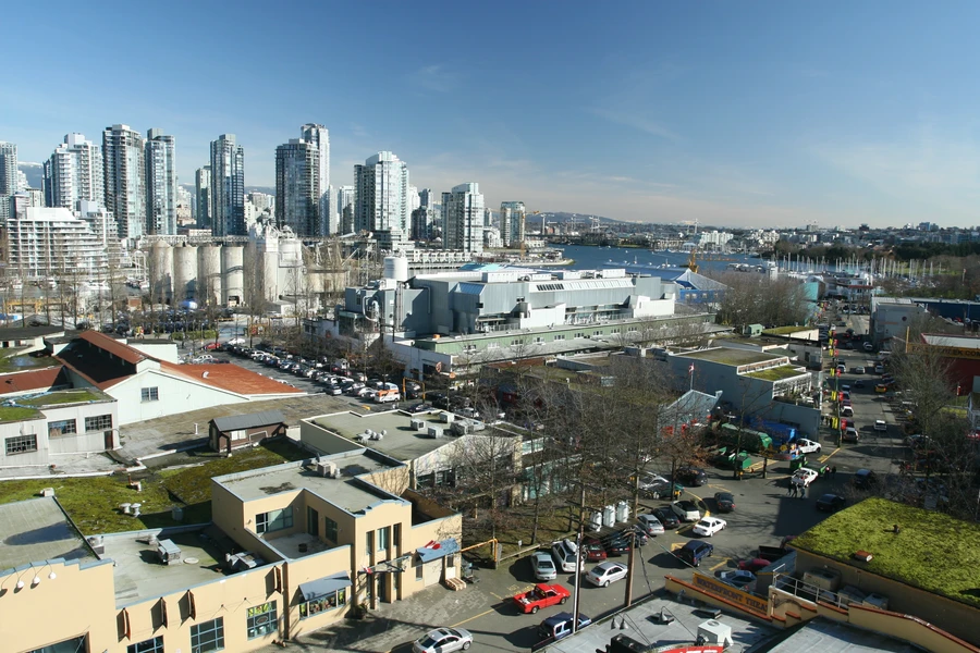 Fremont Troll sculpture under Aurora Bridge with vintage cars in sculpture's hand