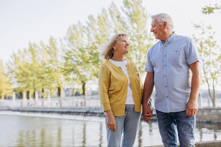 Beautiful senior couple enjoying lakefront retirement